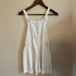 White linen romper with brown details